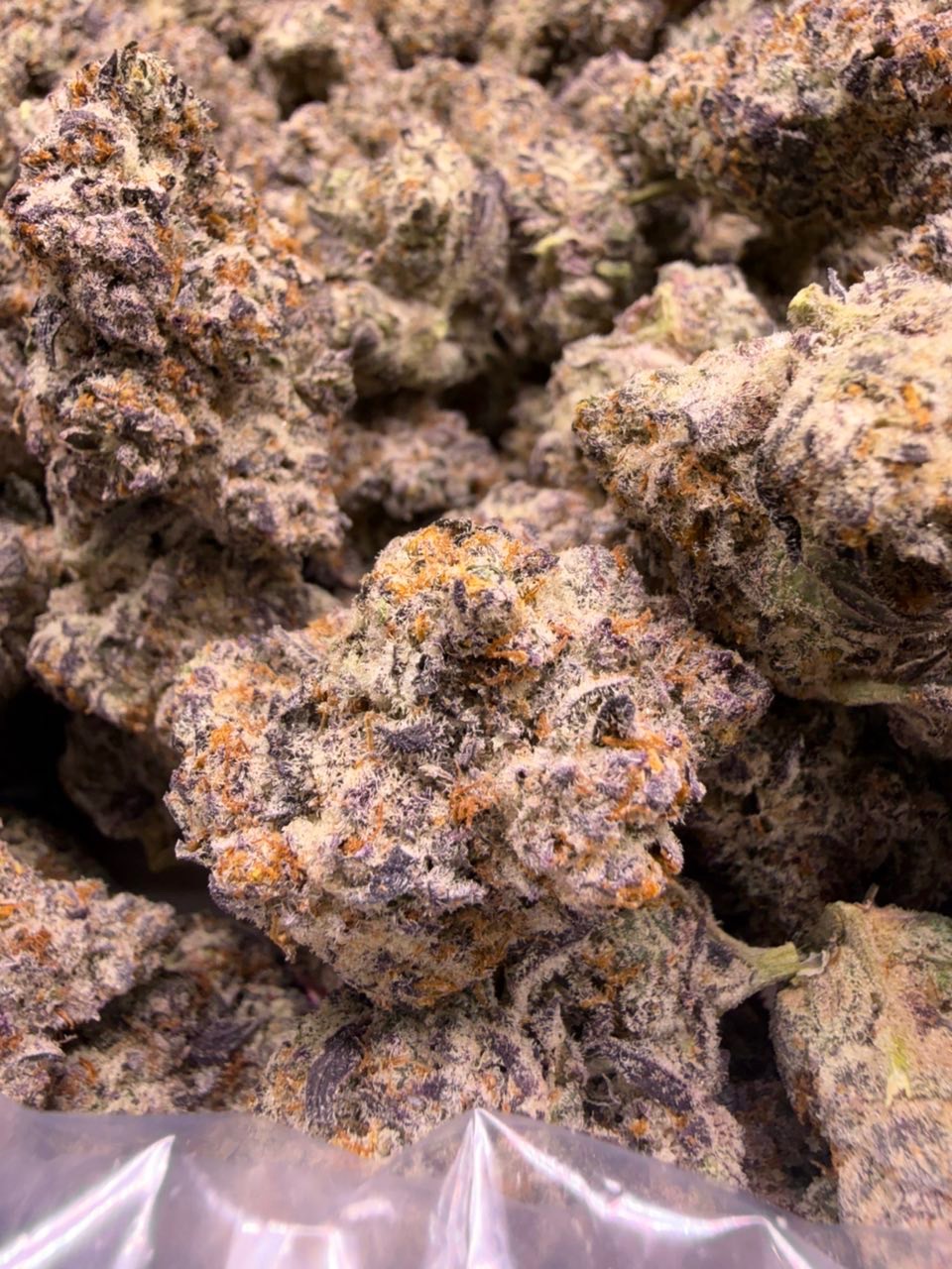 Blue Nerds LG bud — macro shot showing trichomes and structure